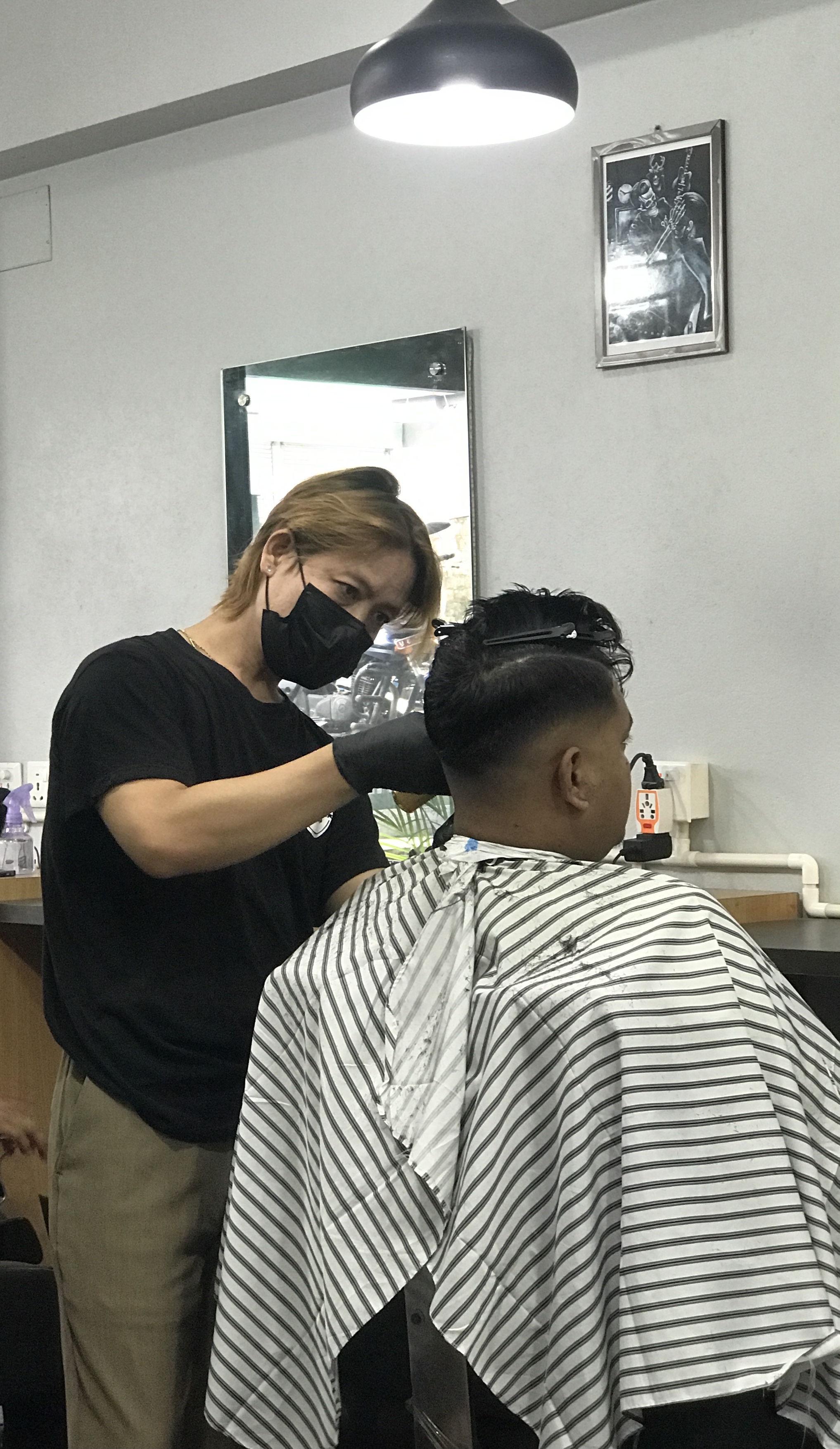 Portrait of Ayus Gurung, founder and master barber at Ayu's Barber