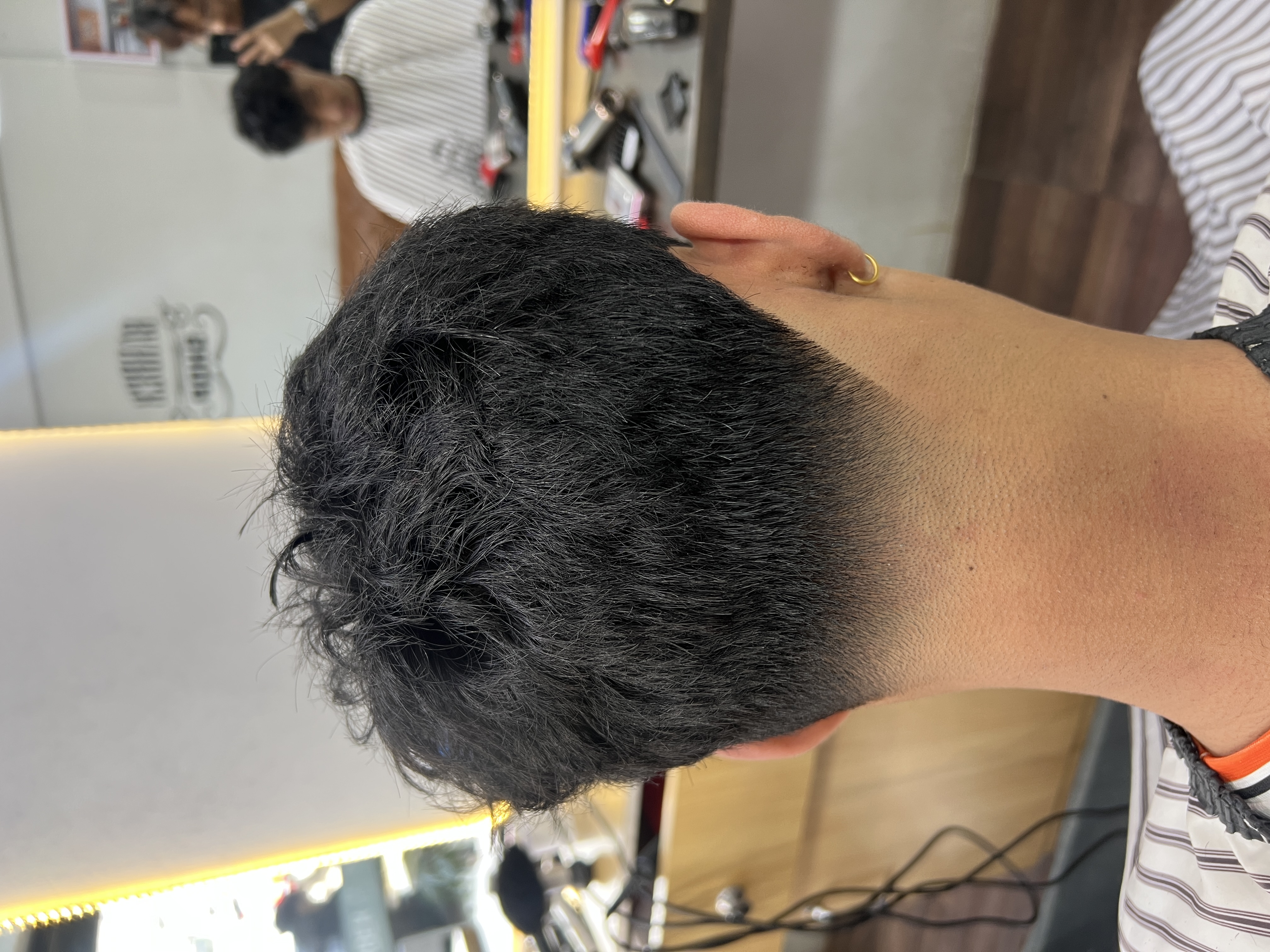 Top back view of a smooth taper blend on dark hair