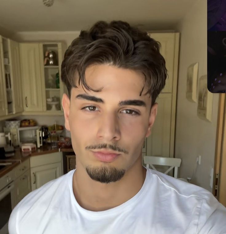 Close view of minimal goatee and mustache beard style