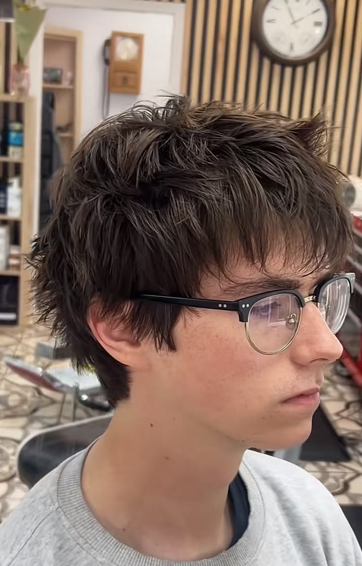 Salon view of textured men's hairstyle with glasses