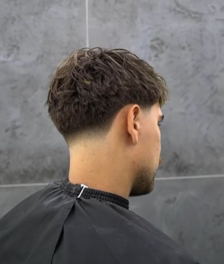 Back view of a rounded textured men's haircut