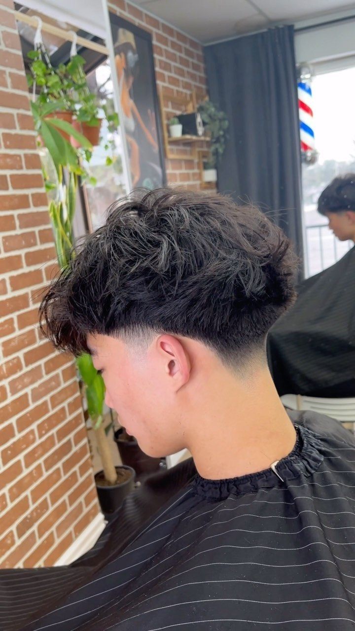Salon side view of a taper men's haircut